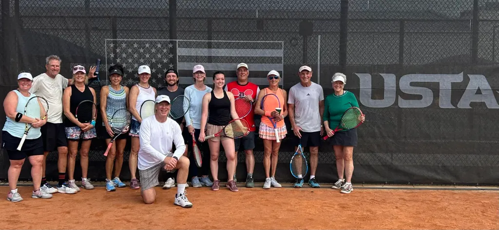 USTA clinic group photo with Coach Mike and adult students at Dalton Ranch